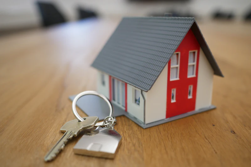 House model and keys on a table